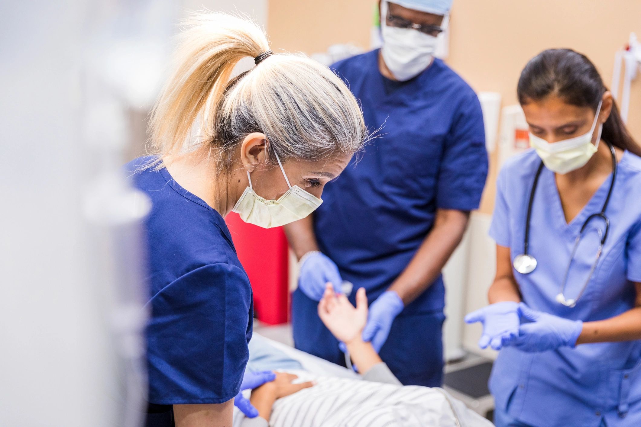 Hospital care team speaking with a patient