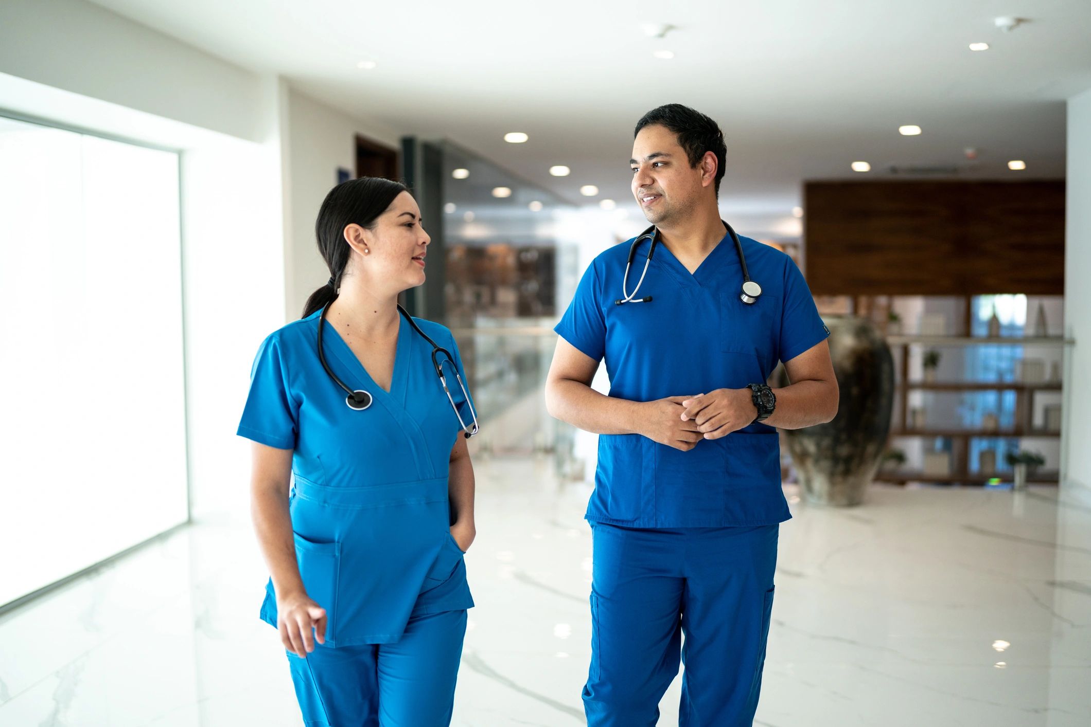 Nurse coworkers walking in a hospital