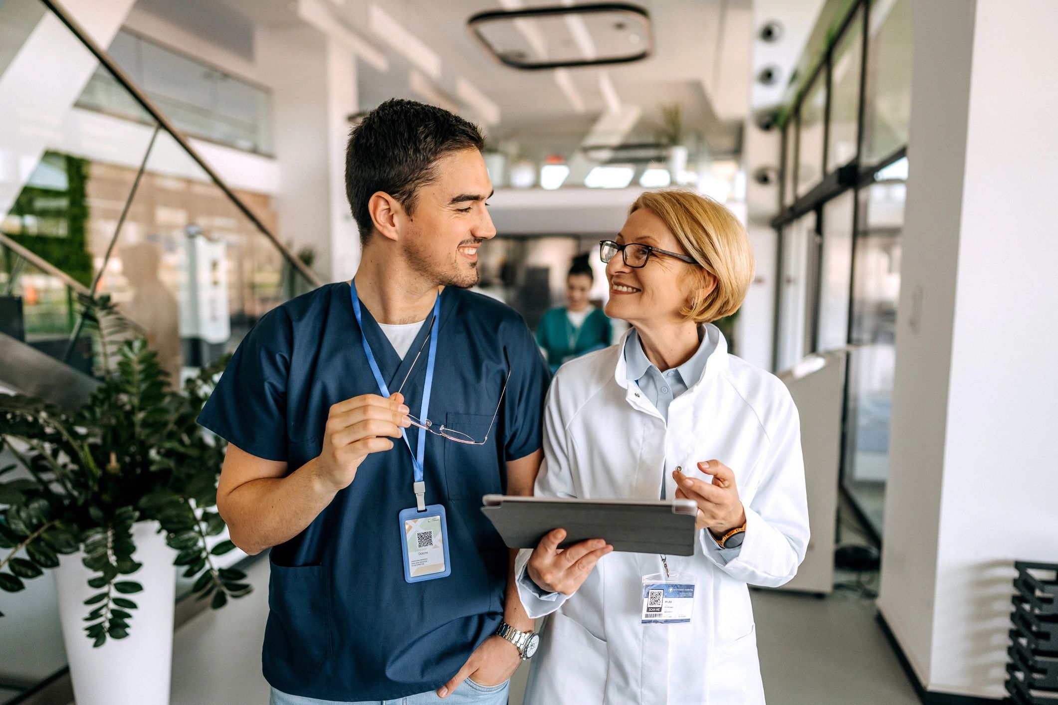 Doctors speaking in a hospital corridor