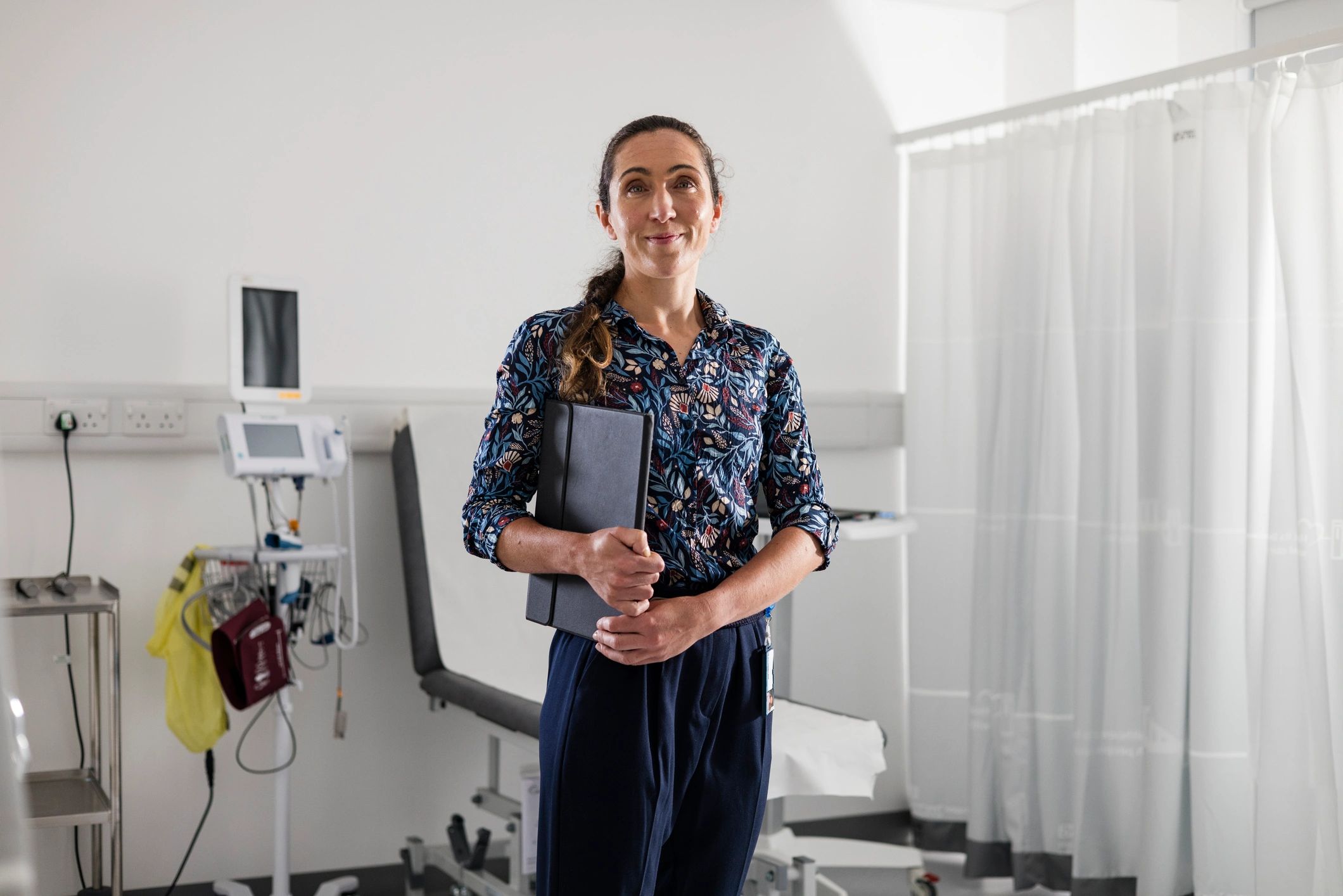 Healthcare professional reviewing information on a tablet