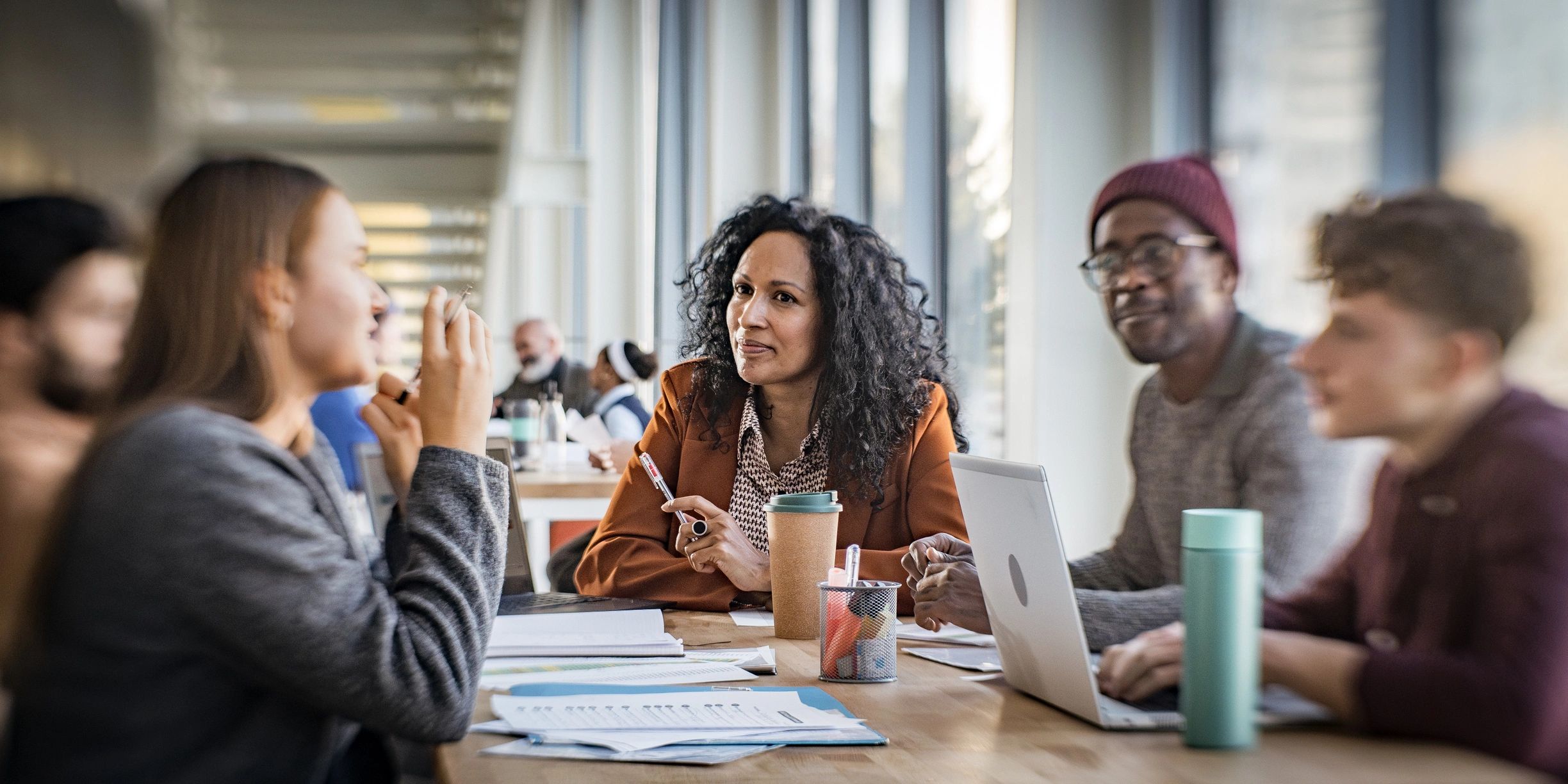 Professionals collaborating during a healthcare discussion