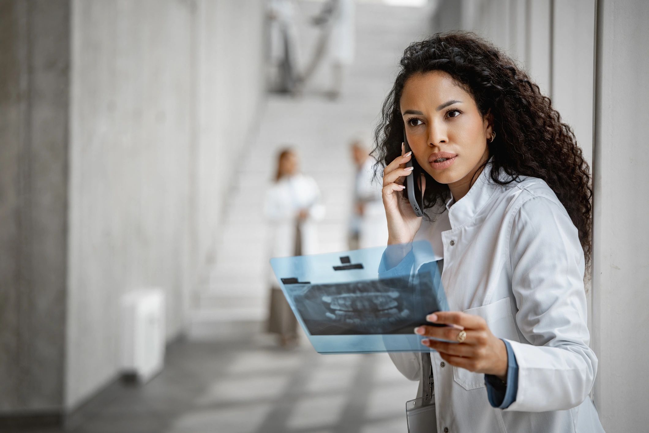 Medical professional reviewing an X-ray in a clinic